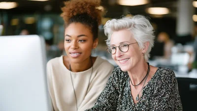 Diverse Female Colleagues Collaborating On A Computer