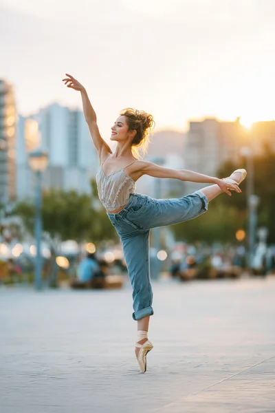 Ballerina Performing Ballet Pose In Casual Clothing