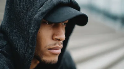 Close Up Portrait Of A Young Man In A Hoodie
