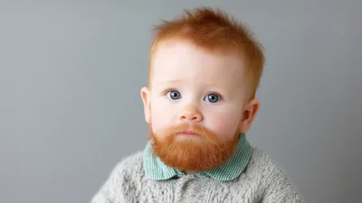 Portrait Of A Baby With A Red Beard