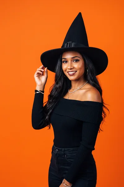 Young Woman Wearing Witch Hat For Halloween