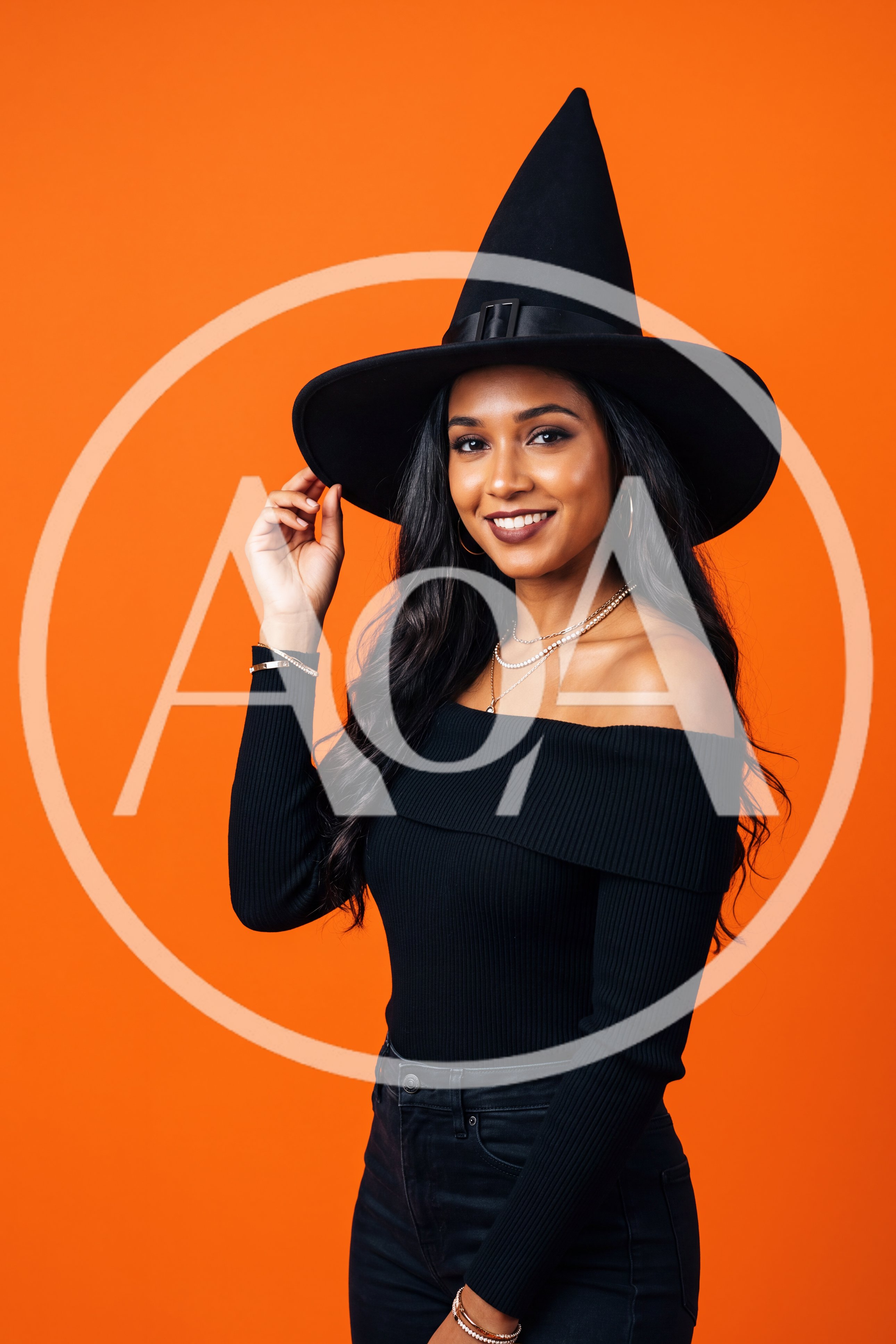 Young Woman Wearing Witch Hat For Halloween