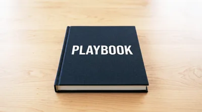 Black Playbook Book Resting On A Wooden Table