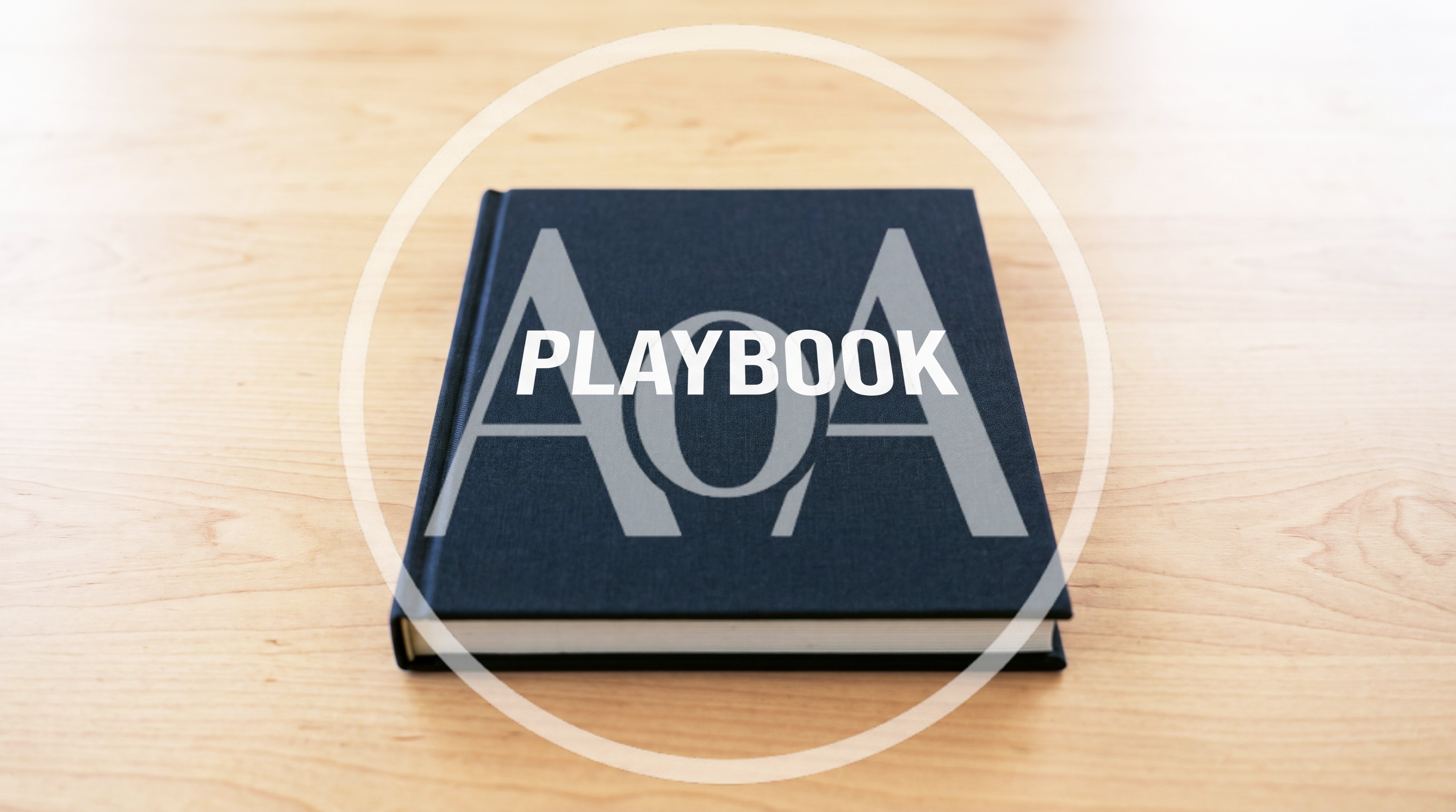 Black Playbook Book Resting On A Wooden Table