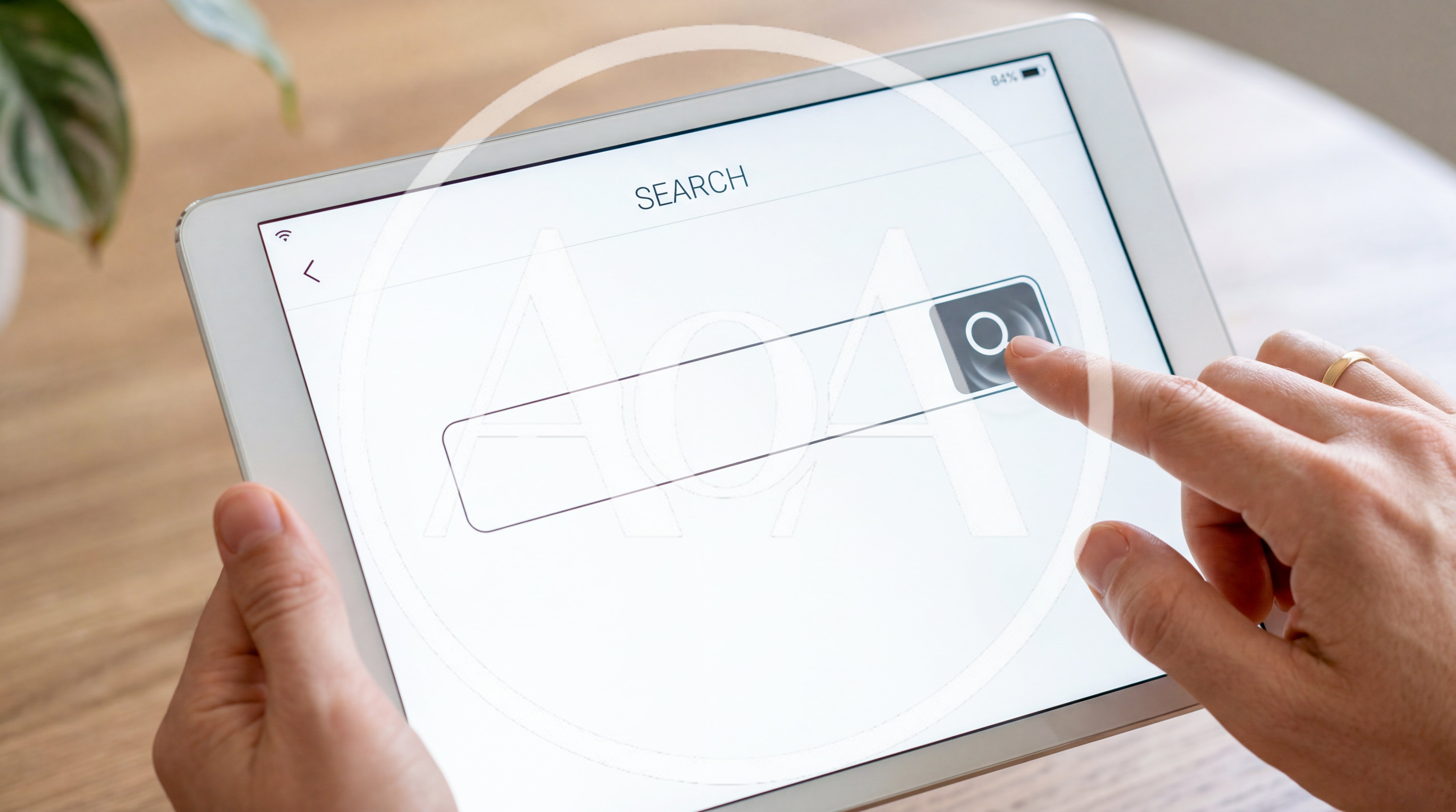 Person Using Search Bar on Tablet Computer