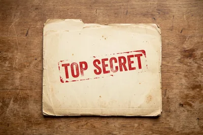 Top Secret File Folder On Wooden Desk