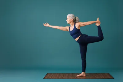 Senior Woman Practicing Dancer Pose Yoga