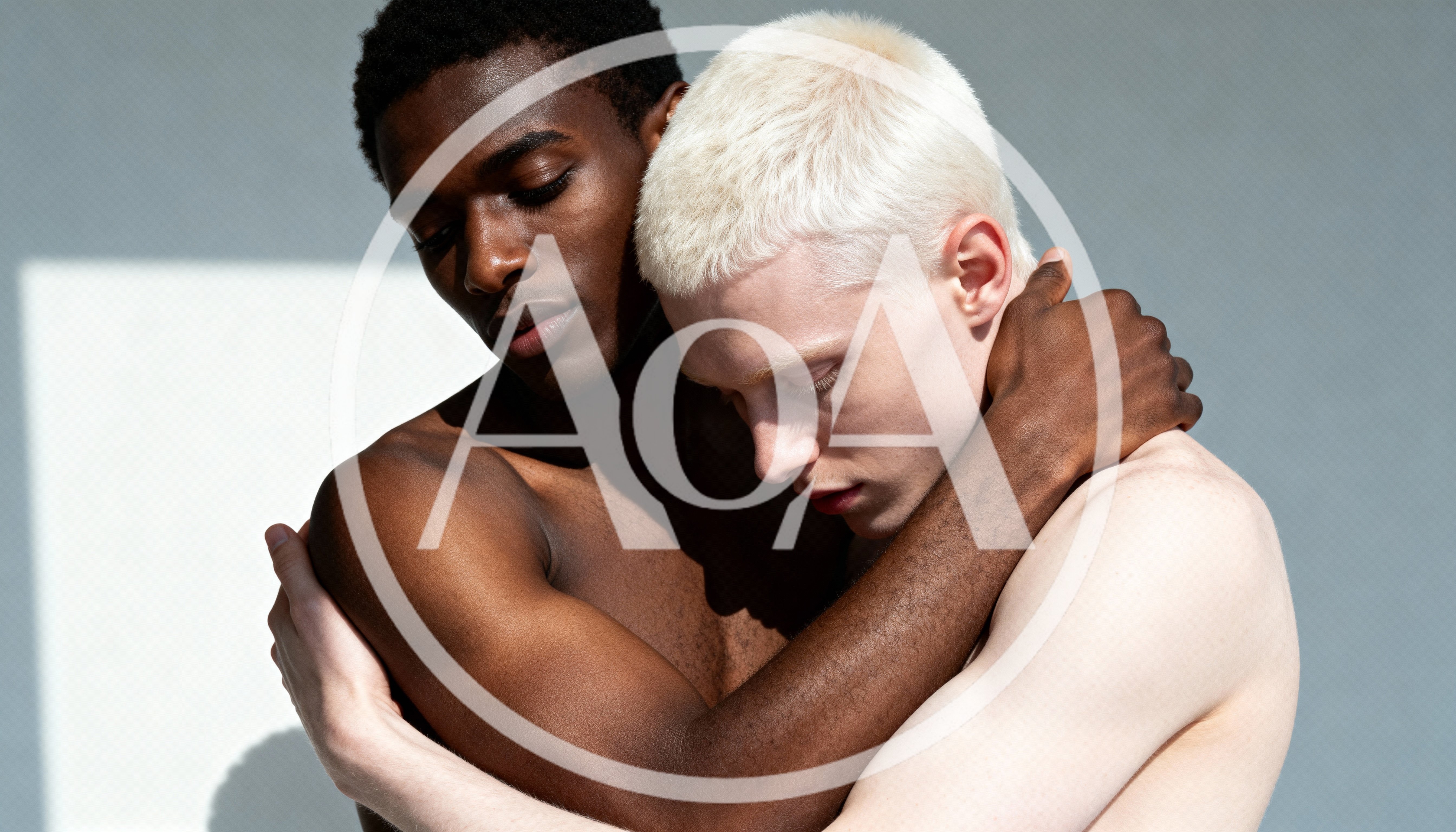 Two Men Embracing Against A Minimalist Background