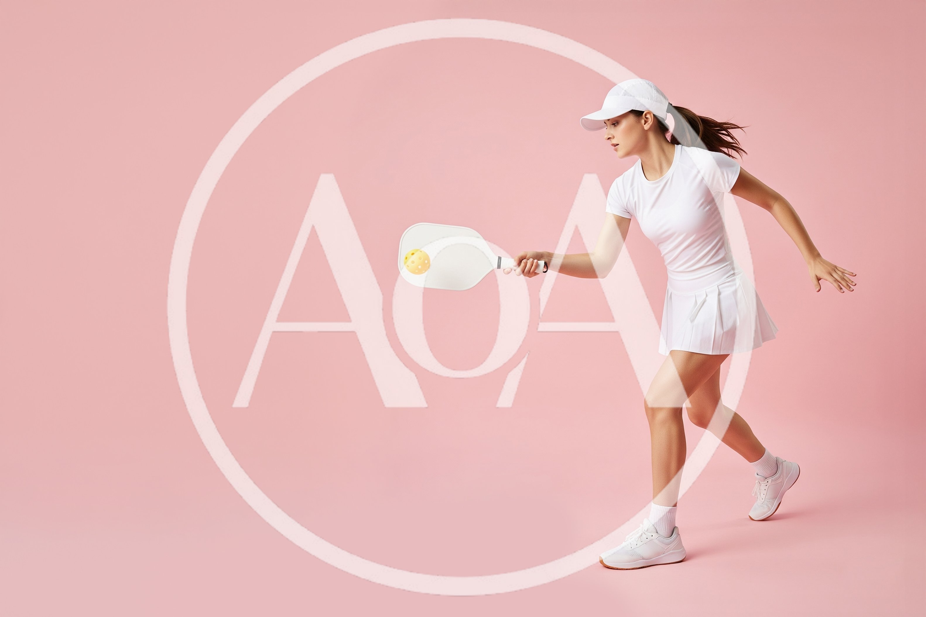 Young Woman Playing Pickleball on Pink Background
