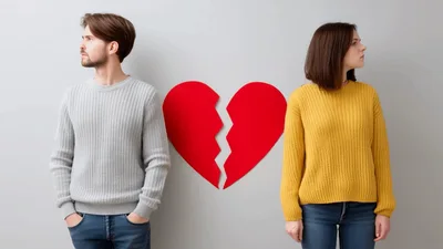 Couple Standing Apart With A Broken Heart Symbol