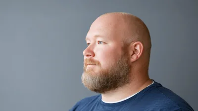 Profile Portrait Of A Bald Man With A Beard