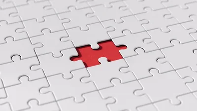 Missing Puzzle Piece In A White Jigsaw