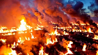 Massive Industrial Oil Field Fire Burning At Night