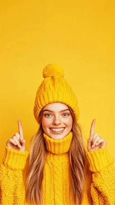 Young Woman Pointing Upwards Against Yellow Background