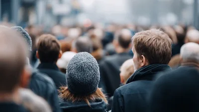 Crowd Of People Walking In A City Street