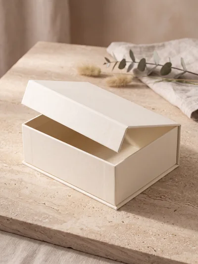 Empty Cream Colored Gift Box On Stone Surface