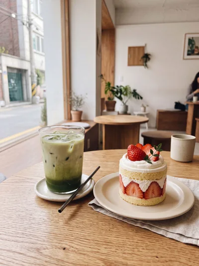 Iced Matcha Latte and Strawberry Cake in Cafe
