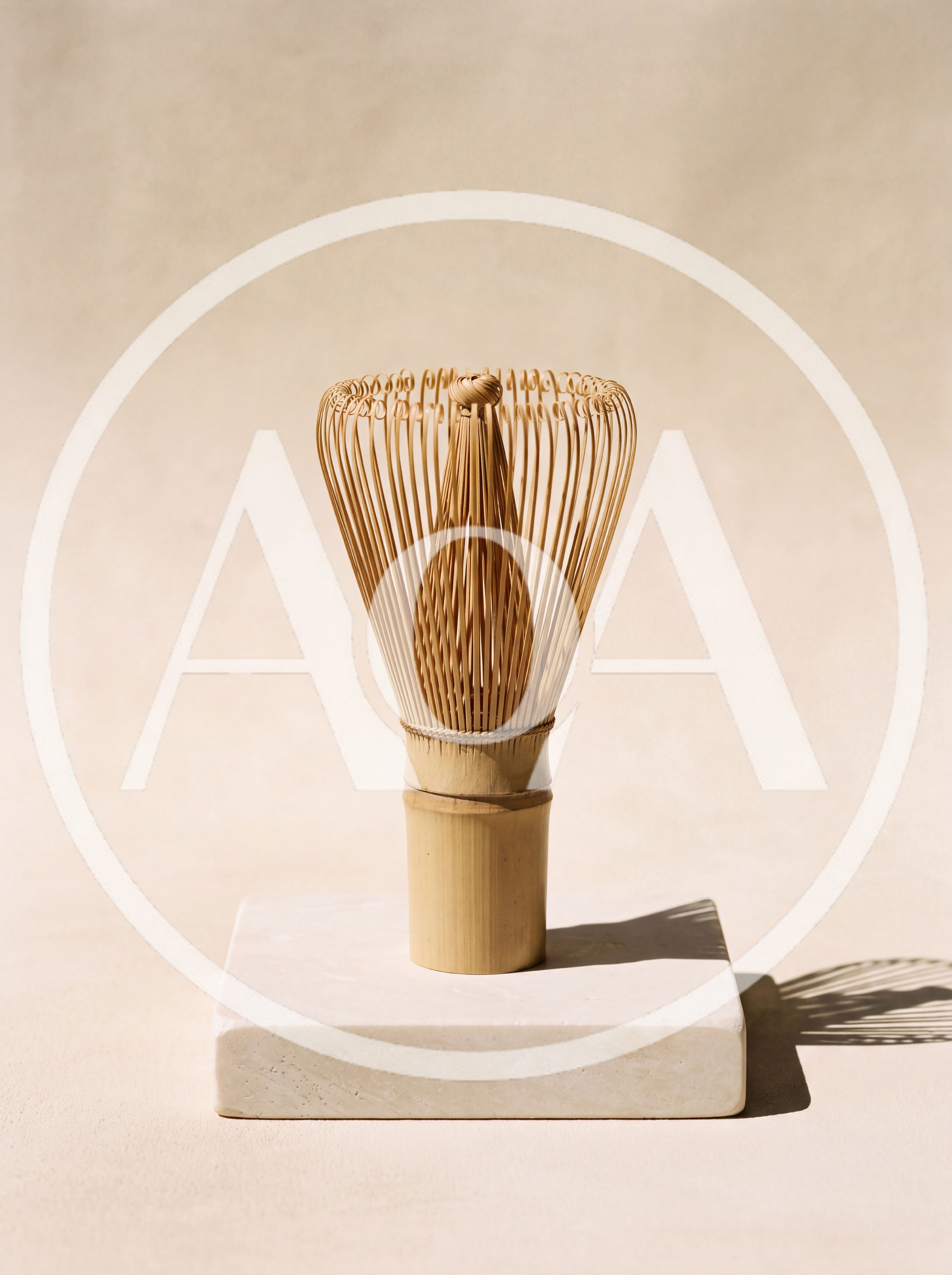 Bamboo Matcha Whisk On A Stone Pedestal