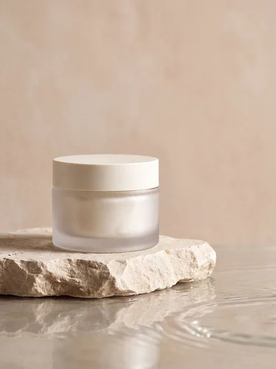 Cosmetic Cream Jar On A Stone Pedestal