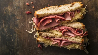 Two Reuben Sandwiches On A Dark Rustic Surface