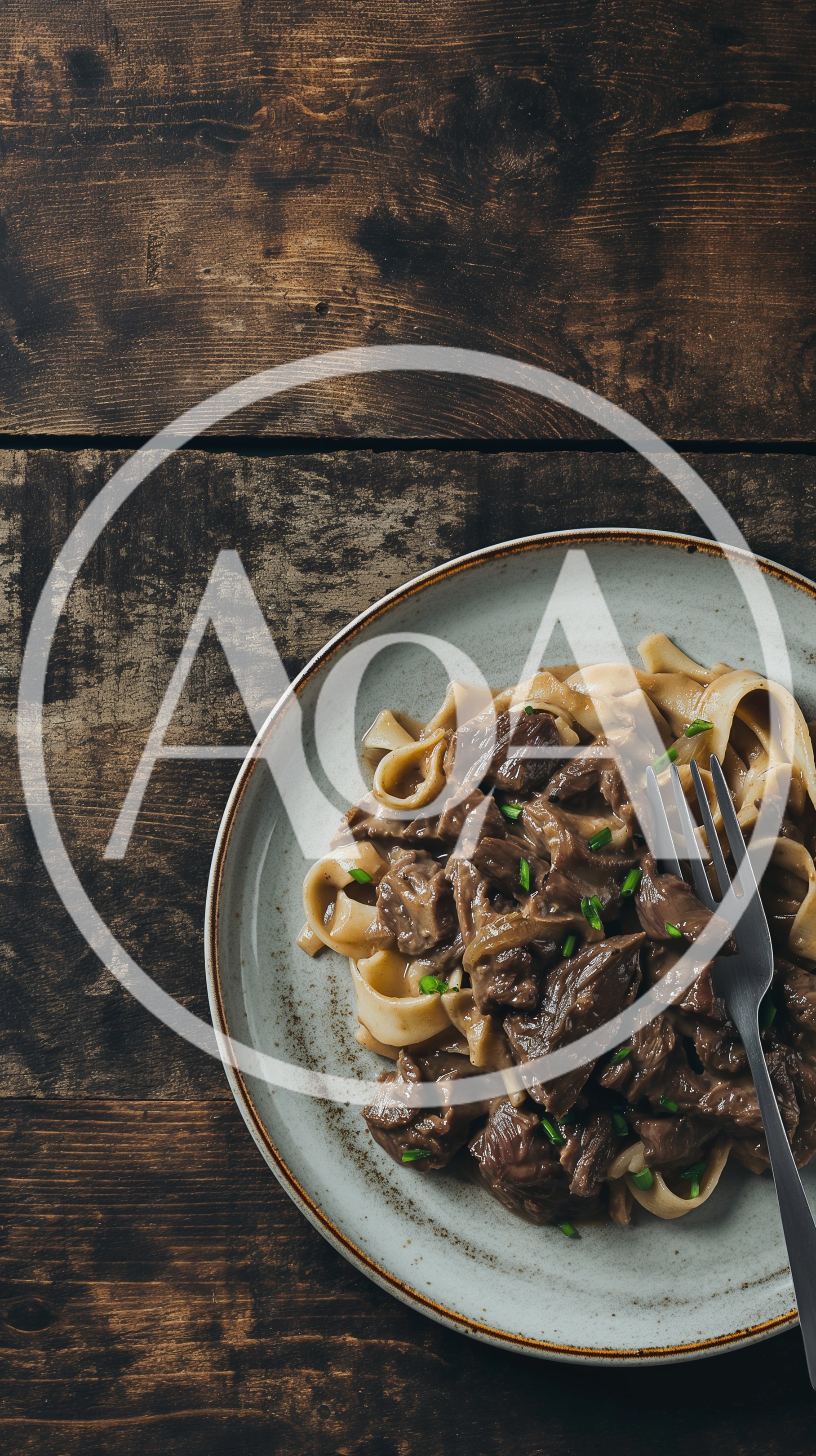 Beef Stroganoff With Egg Noodles On A Rustic Table