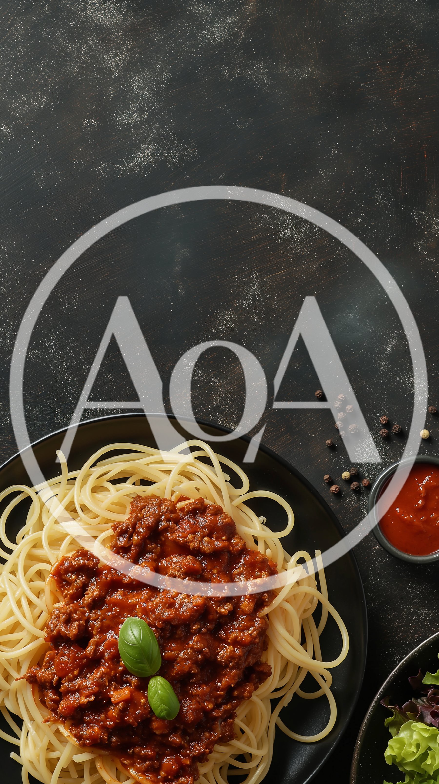 Spaghetti Bolognese Served on a Black Plate