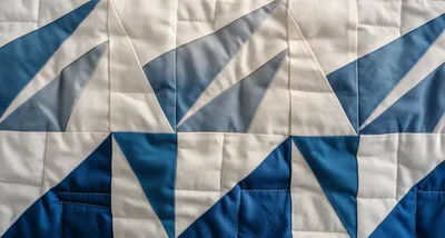 Geometric Blue And White Quilted Fabric Pattern