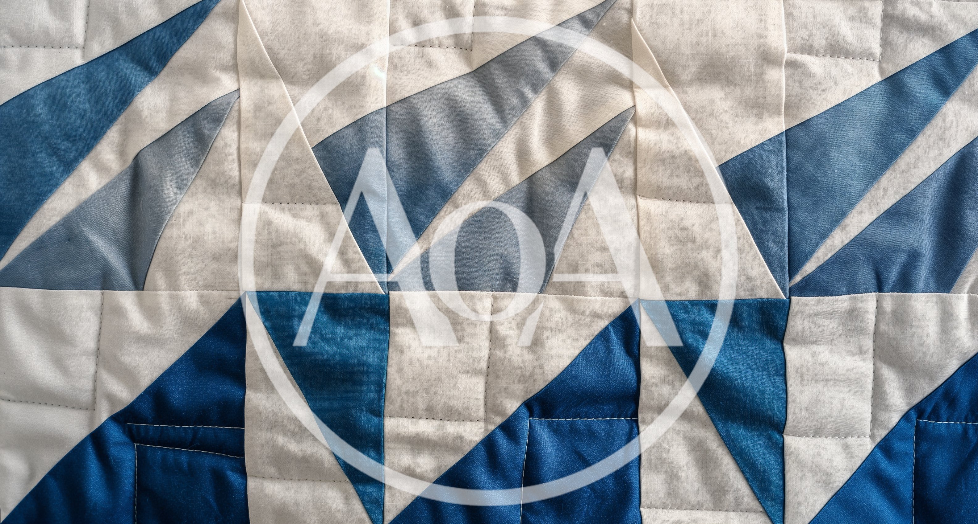 Geometric Blue And White Quilted Fabric Pattern