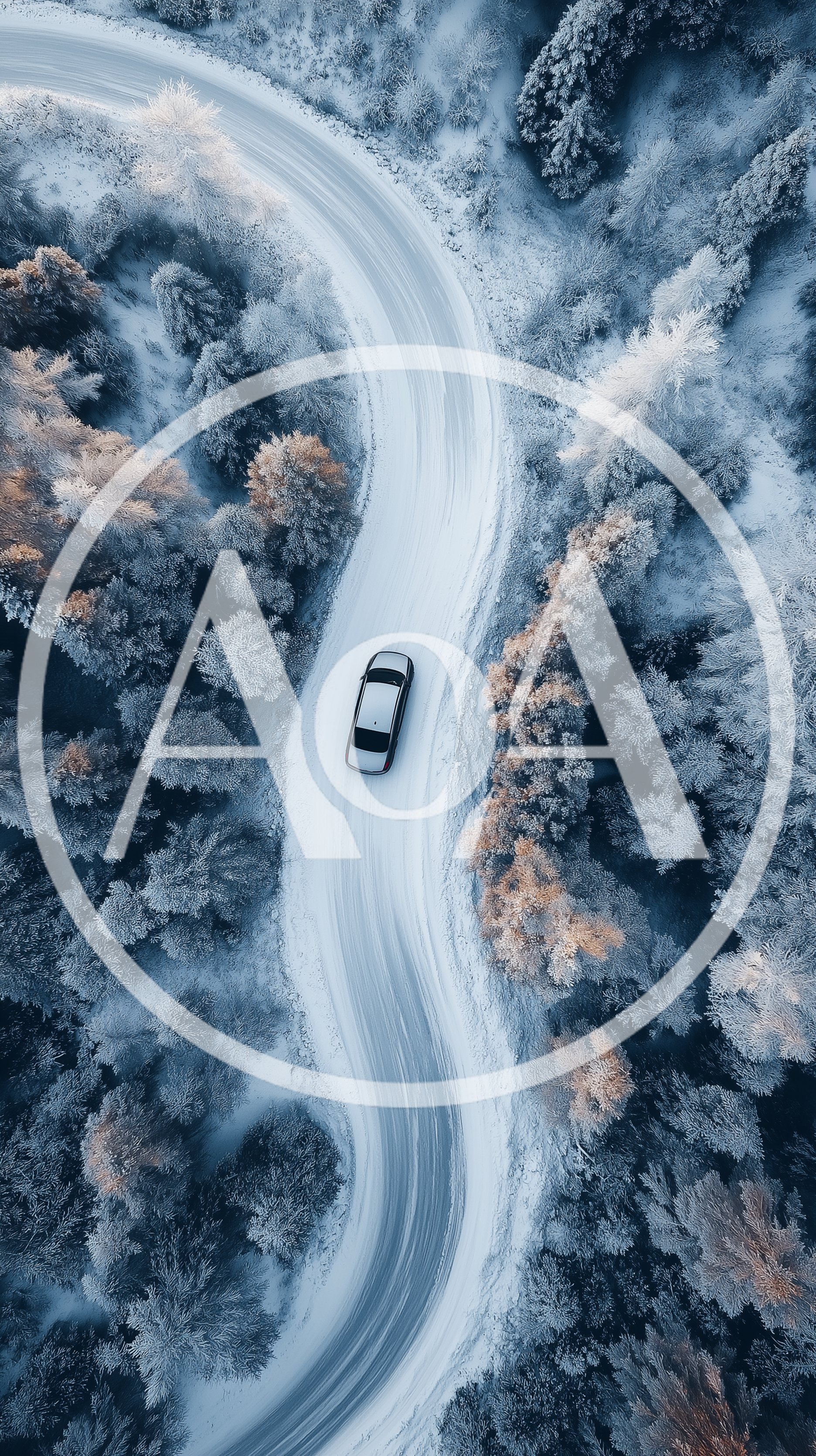 Aerial View Of A Car Driving On Snowy Road