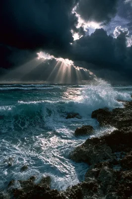 Dramatic Ocean Waves Crashing Against Rocky Shoreline