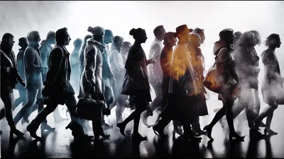 Silhouetted People Walking Through Foggy Urban Street