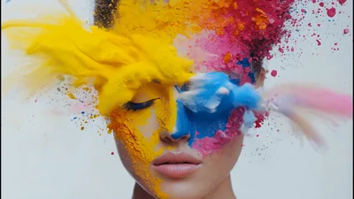 Woman Face Covered In Exploding Yellow And Blue Powder