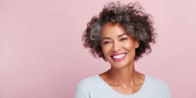 Smiling Mature Woman With Curly Graying Hair
