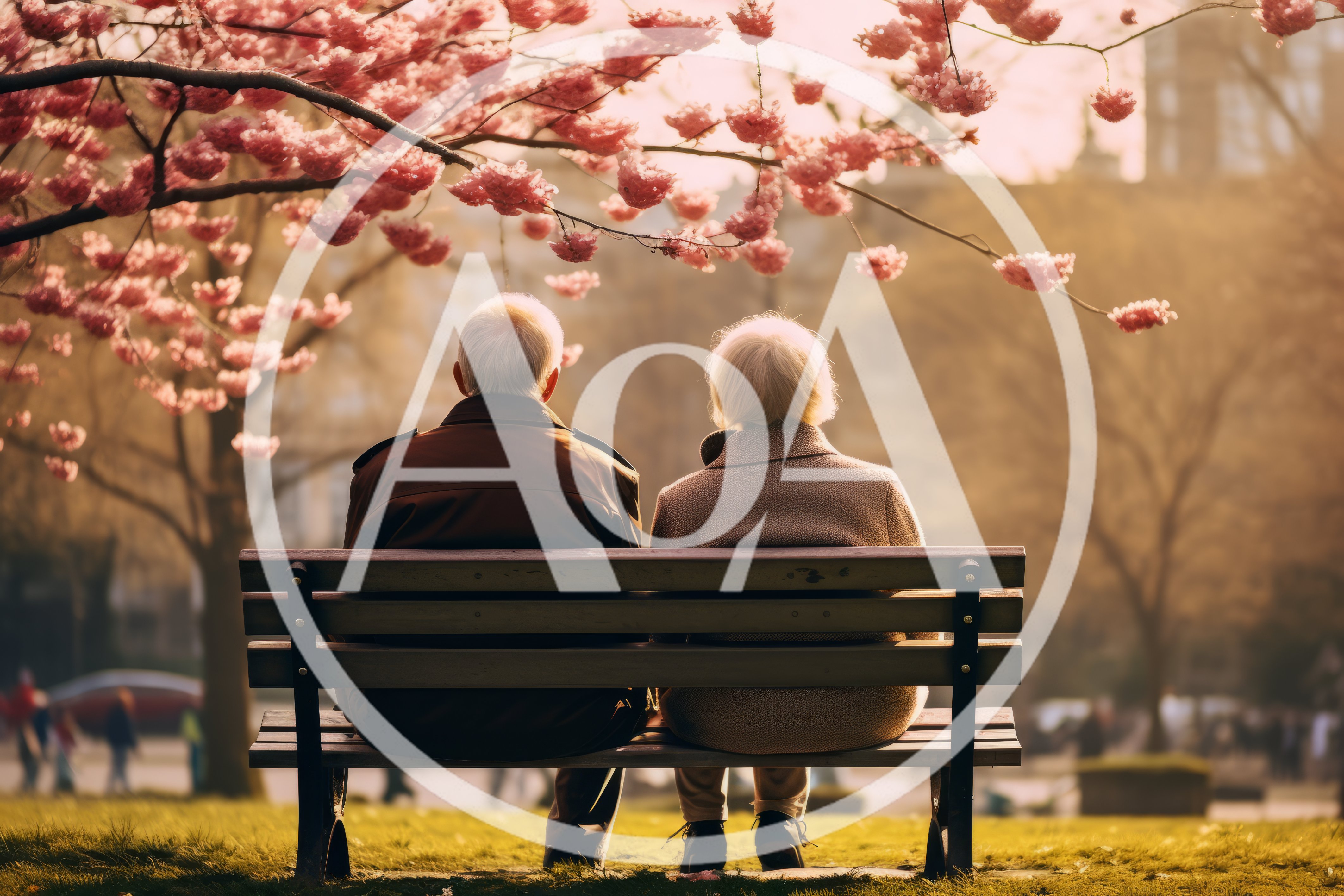 Elderly Couple Sitting Together On A Park Bench