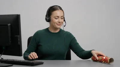Customer Service Representative Pulling A Christmas Cracker