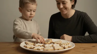 Young Boy Picking A Cookie From A Plate