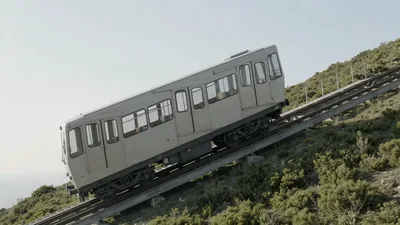 Funicular Train Climbing Up A Steep Mountain Slope