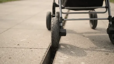 Stroller Wheel Stuck In Sidewalk Drainage Gap