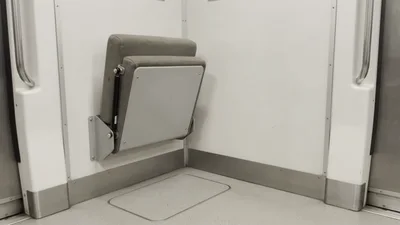 Folding Train Seat Closing Against The Wall