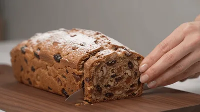 Slicing A Fruit And Nut Loaf Cake