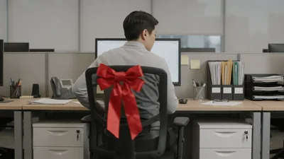 Office Worker Surprised By Red Bow On Chair