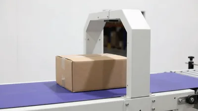 Cardboard Box Moving Along Automated Conveyor Belt