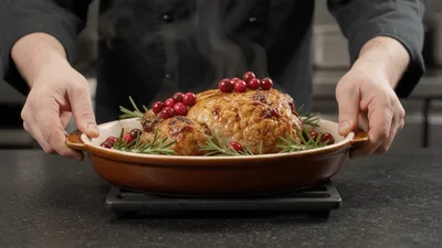 Chef Placing Roasted Chicken On A Cooling Rack