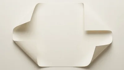 Four Corners Of Paper Folding Inward On White Background