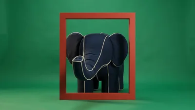 Dark Blue Fabric Elephant Toy Turning Inside Red Frame