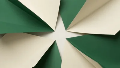 Four Paper Triangles Folding Together To Form A Square