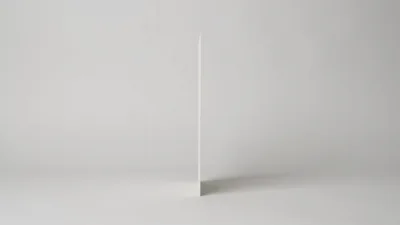 Blank White Card Rotating On A Grey Background