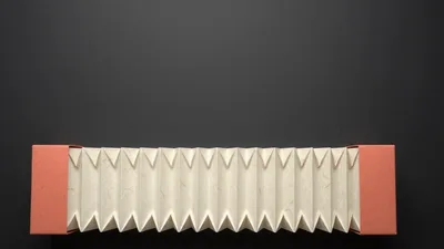 Accordion Fold Paper Expanding On Dark Background