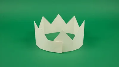 Paper Crown Being Assembled On Green Background