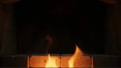 Fire Igniting In A Brick Fireplace Hearth